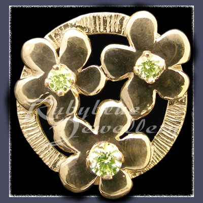 Gold 'Circle of Flowers' Lapel Pin with August Birthstones Image