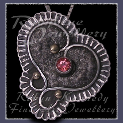 10 Karat Yellow Gold, Sterling Silver and Pink Topaz 'Braveheart' Pendant / Brooch Image
