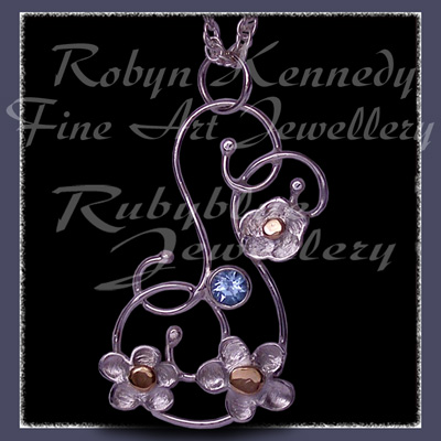 10 Karat Yellow Gold, Sterling Silver & Sky Blue Topaz 'Feeling Groovy'  Pendant Image