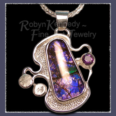 Sterling Silver Pendant showcasing a blue, purple and green Genuine Ammolite and amethyst Gemstones