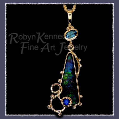 14 Karat Yellow Gold, Ammolite, Blue Sapphire and Blue Topaz 'Rhapsody in Blue' Pendant Image
