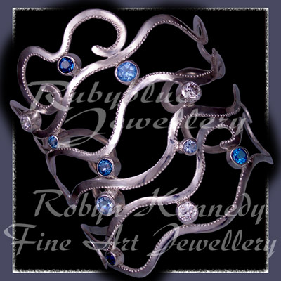 Sterling Silver, Various Blue Topaz' and Cubic Zirconia's 'Seiche' Bangle Bracelet